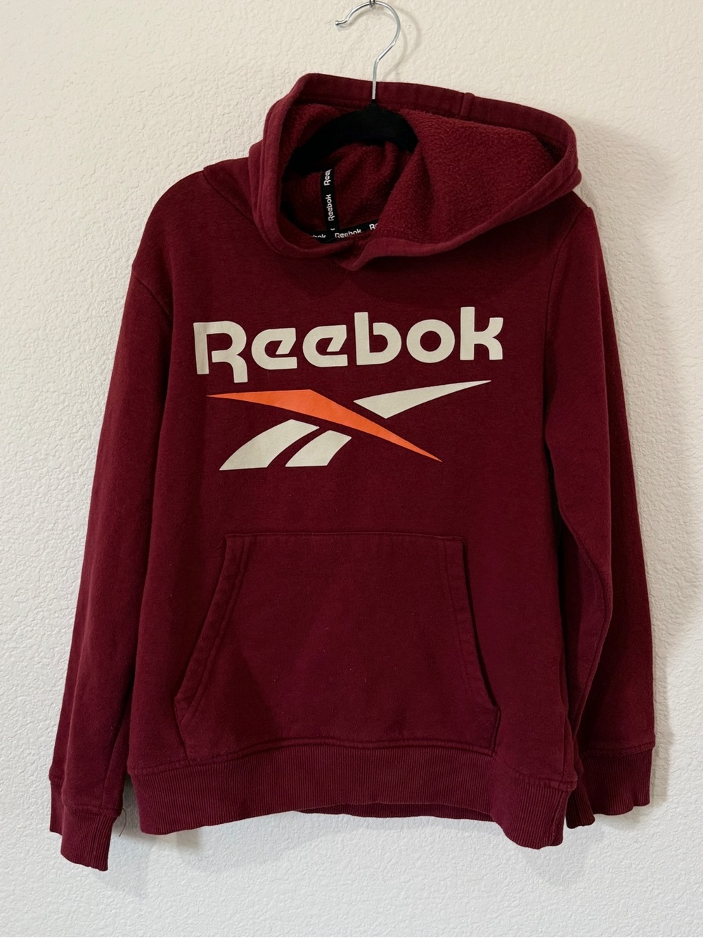 Reebok Kid’s Maroon Hoodie with Beige & Orange Logo Size 8.